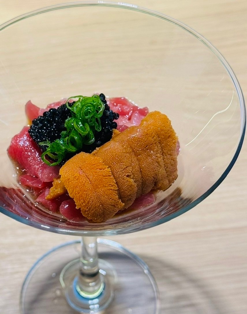 Tuna, sea urchin and caviar layered in a glass, topped with scallion — Kasen's Premium signature dish.