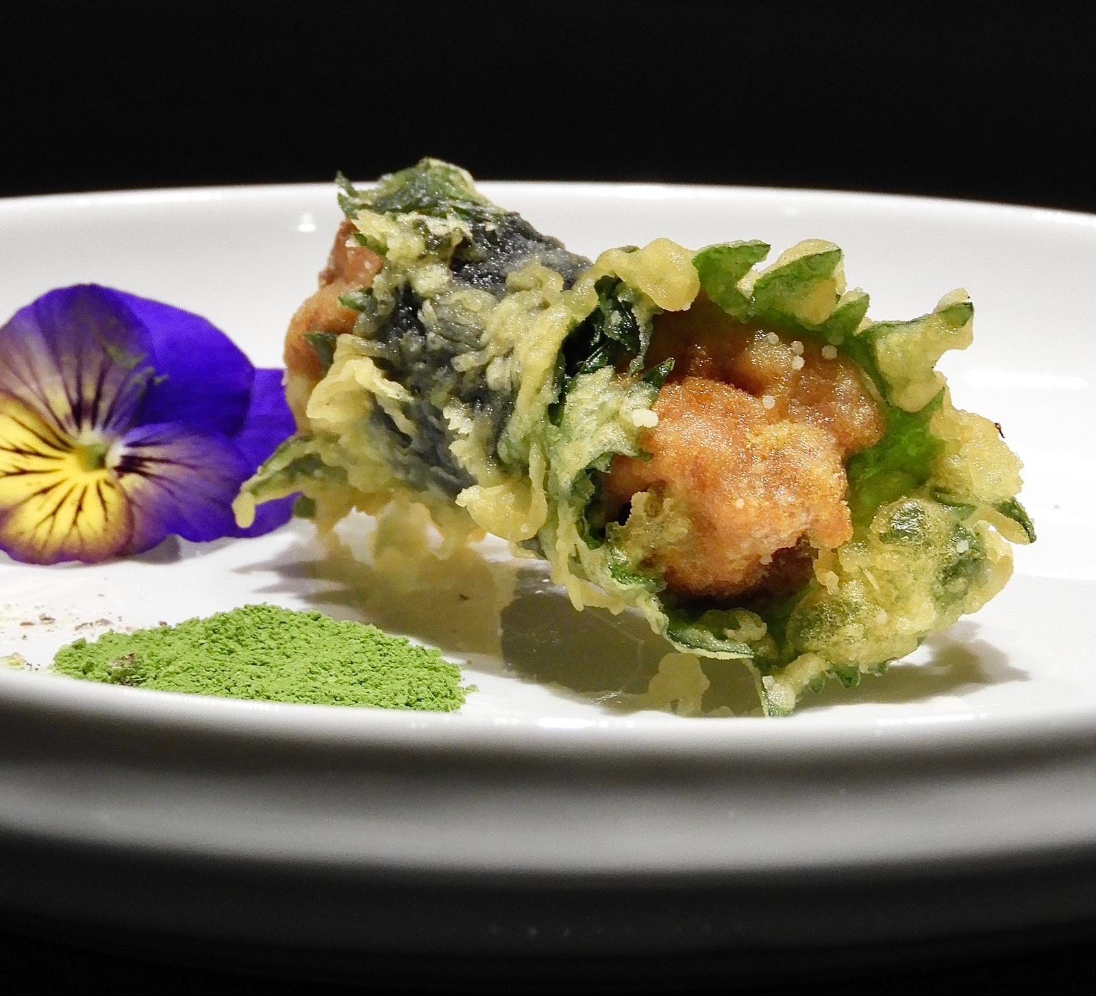 Sea urchin tempura wrapped in shiso, served with matcha salt.