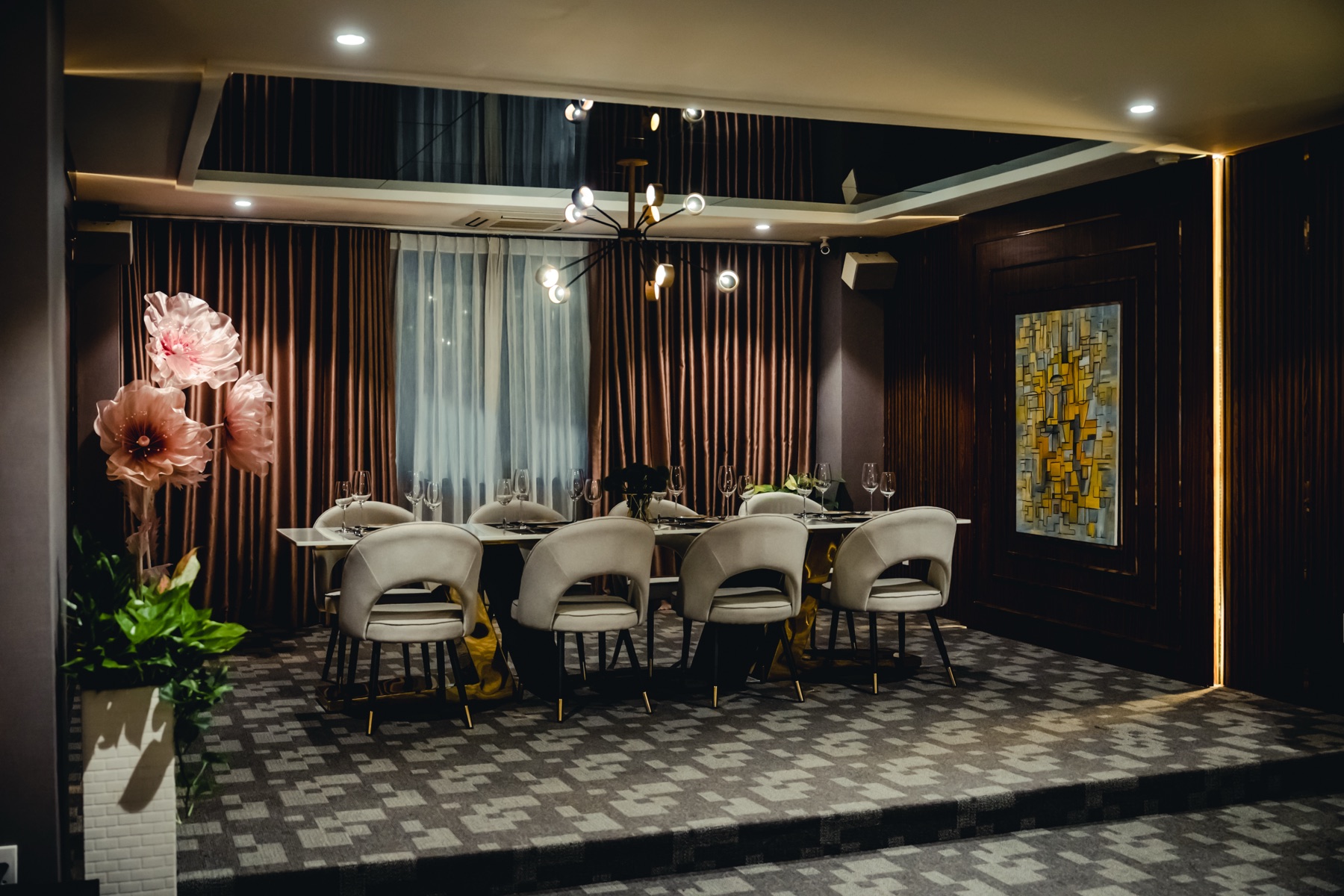 Kasen's private room, a long table set for a group beneath velvet curtains and abstract art